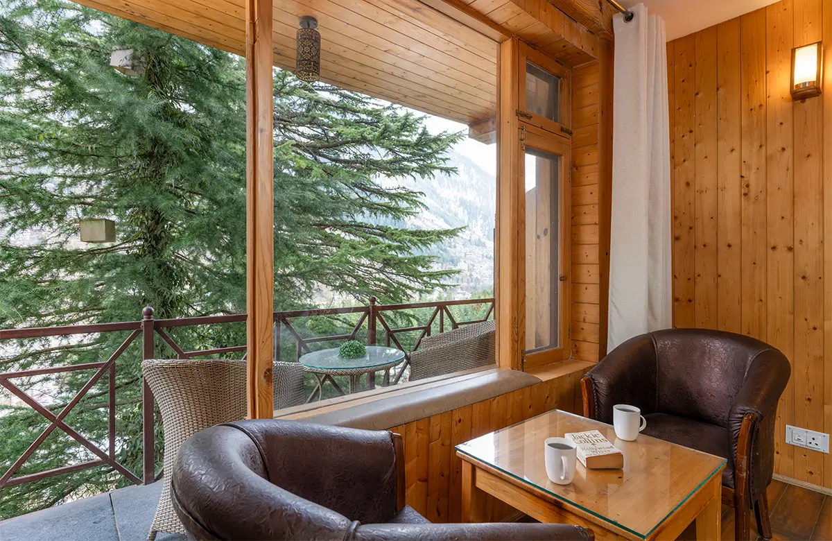 seating-area-and-balcony-view-from-the-nook-manali